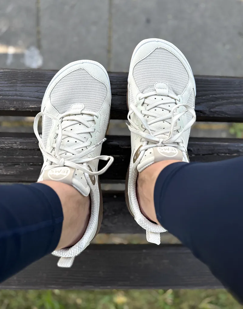 Sneakers worn outdoors, top-down view