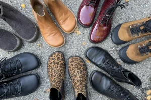 A mix of barefoot boots in black, brown, and leopard print, displayed together.
