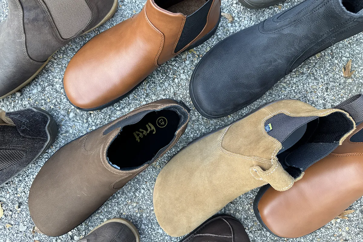 Mixed styles of men’s barefoot Chelsea boots in brown, tan, and black leather.