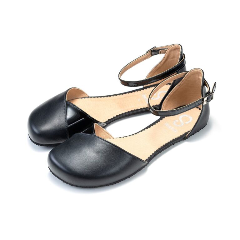 Black Mary Jane ballet flats with ankle strap, studio background